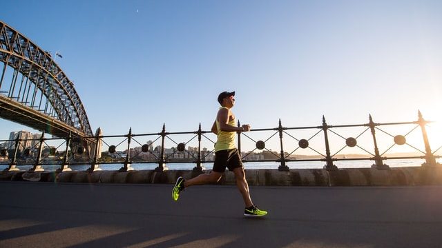 Man running in the morning along the sea side in Sydney