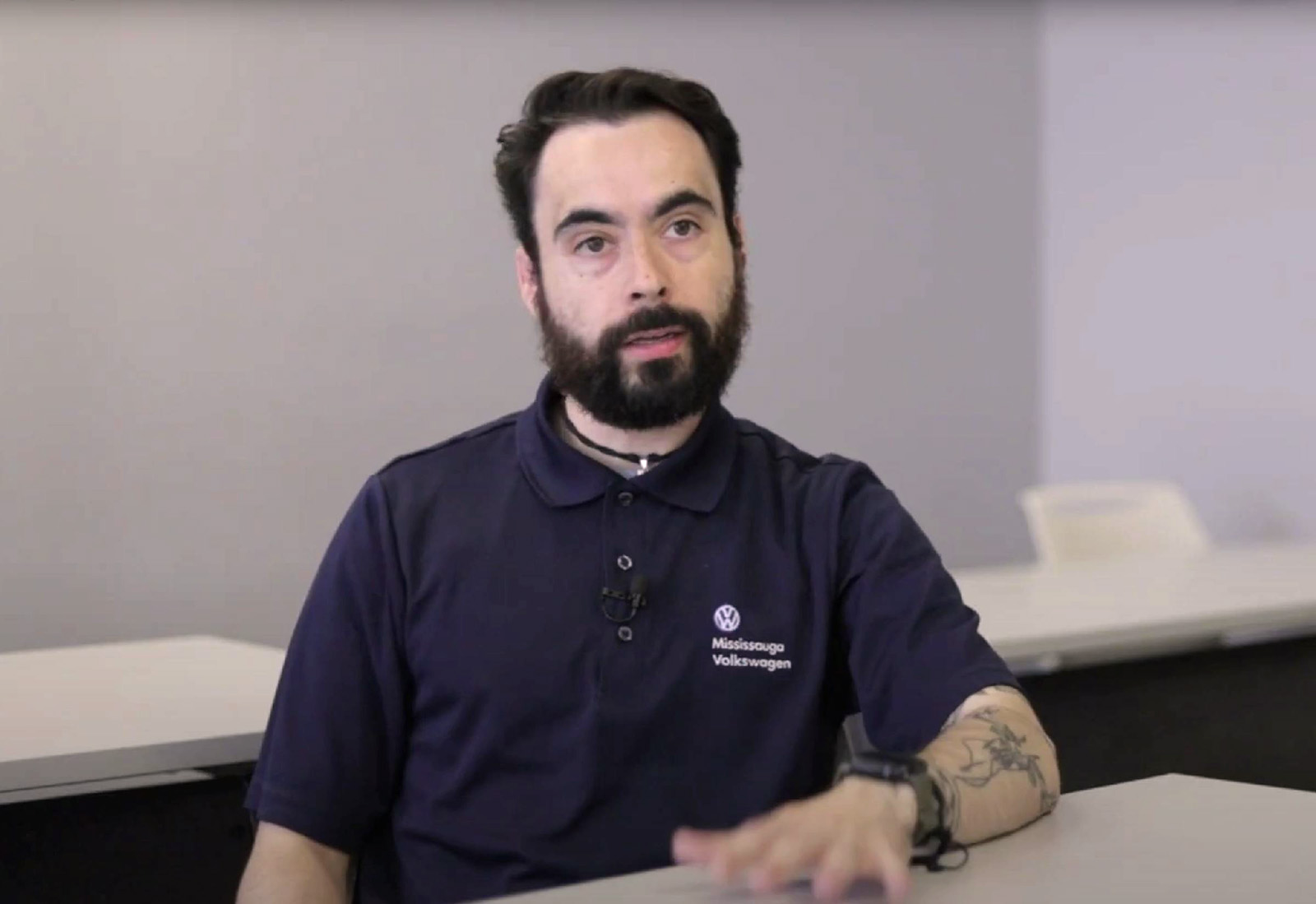 Greystone College Toronto student in co-op position with Volkswagon, wearing company polo